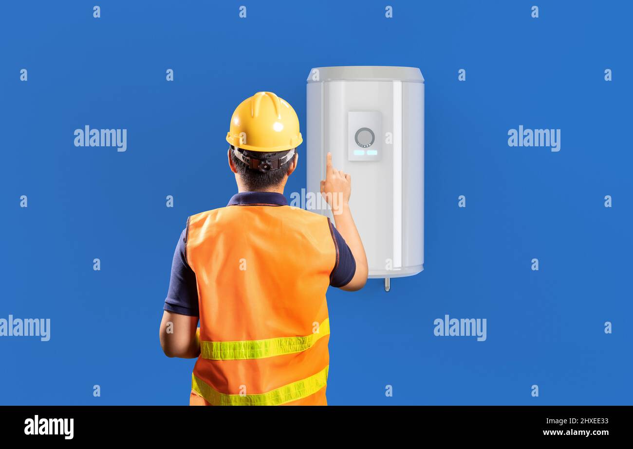 Technician check on boiler or water heater on wall Stock Photo Alamy
