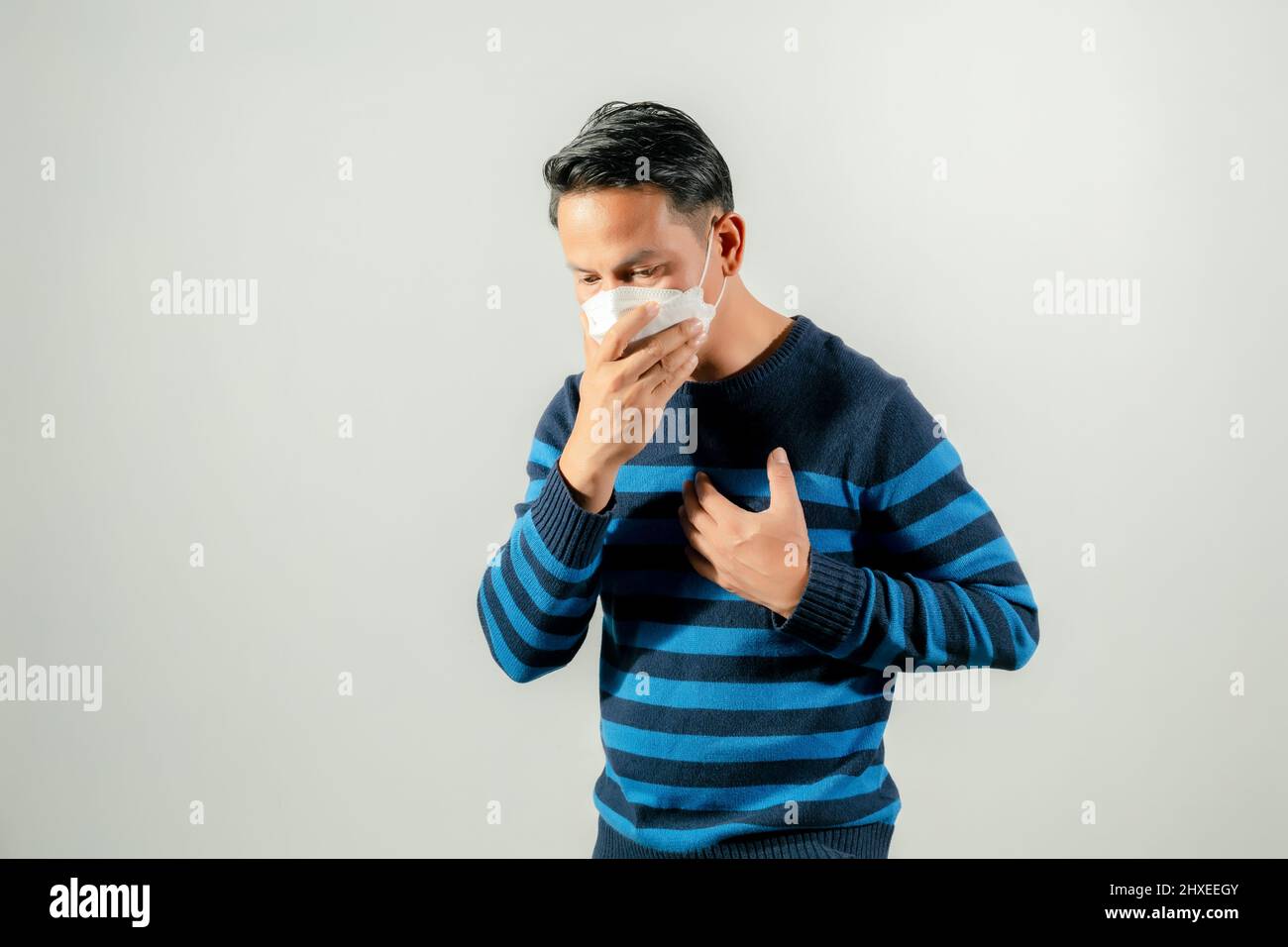 man unwell, headache, chest pain Stock Photo Alamy