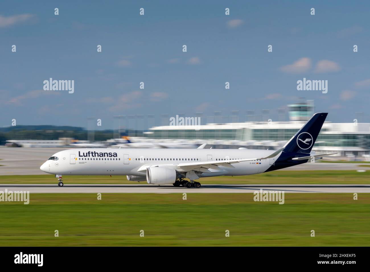 Munich, Germany - September 12. 2021: Lufthansa Airbus A350-941 with the aircraft registration D-AIXC is starting on the southern runway 26L of the Mu Stock Photo