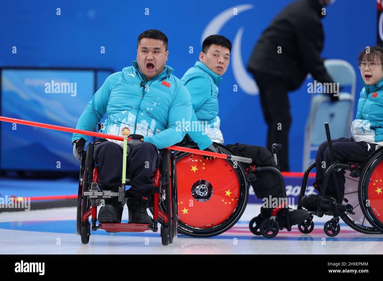Beijing, China. 12th Mar, 2022. Wang Haitao (L) reacts during the ...
