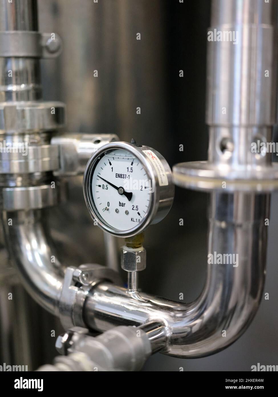 Detail of the barometer on a machine in a brewery. Stock Photo