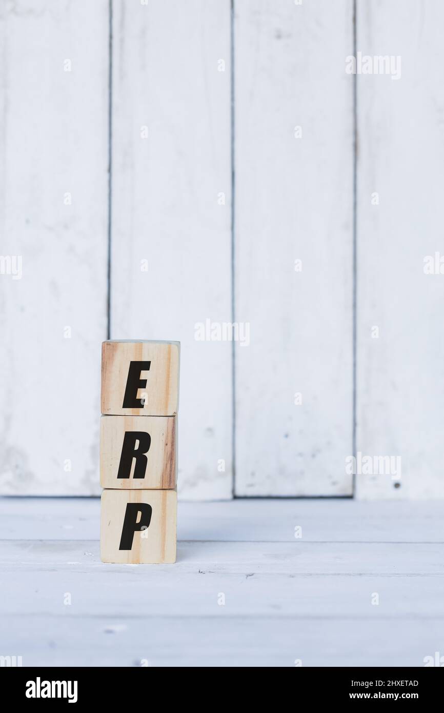 erp concept written on wooden cubes or blocks, on white wooden background. Stock Photo