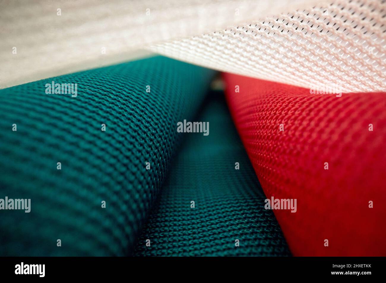 Macro view of the weaving structure of the Italian flag under the light. Flag, country, patriotic Stock Photo