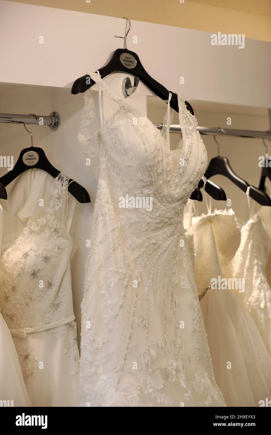 A selection of white wedding dresses pictured in a dress shop in