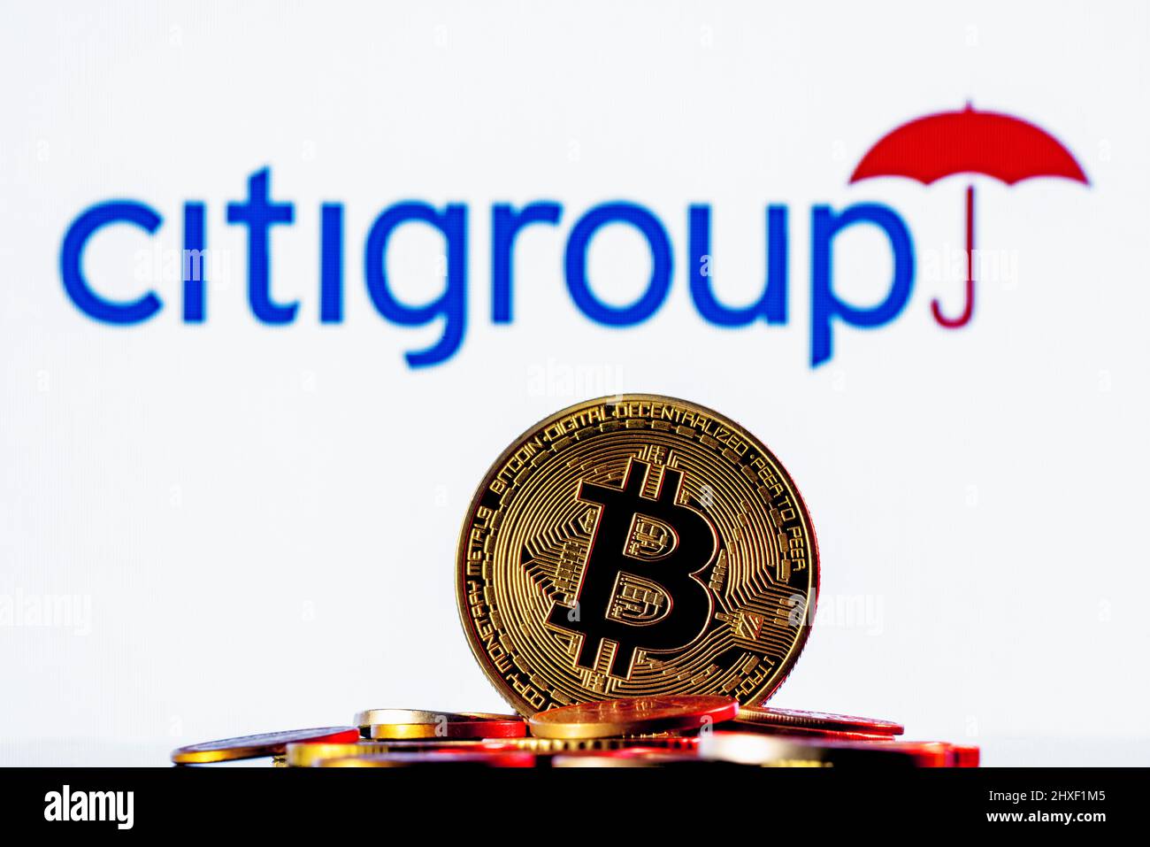 Golden bitcoin in a pile of coins on the background of Citigroup logo Stock  Photo - Alamy