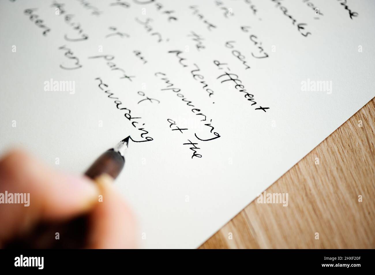 Writing letter to a friend Hand holding a fountain pen Stock Photo Alamy