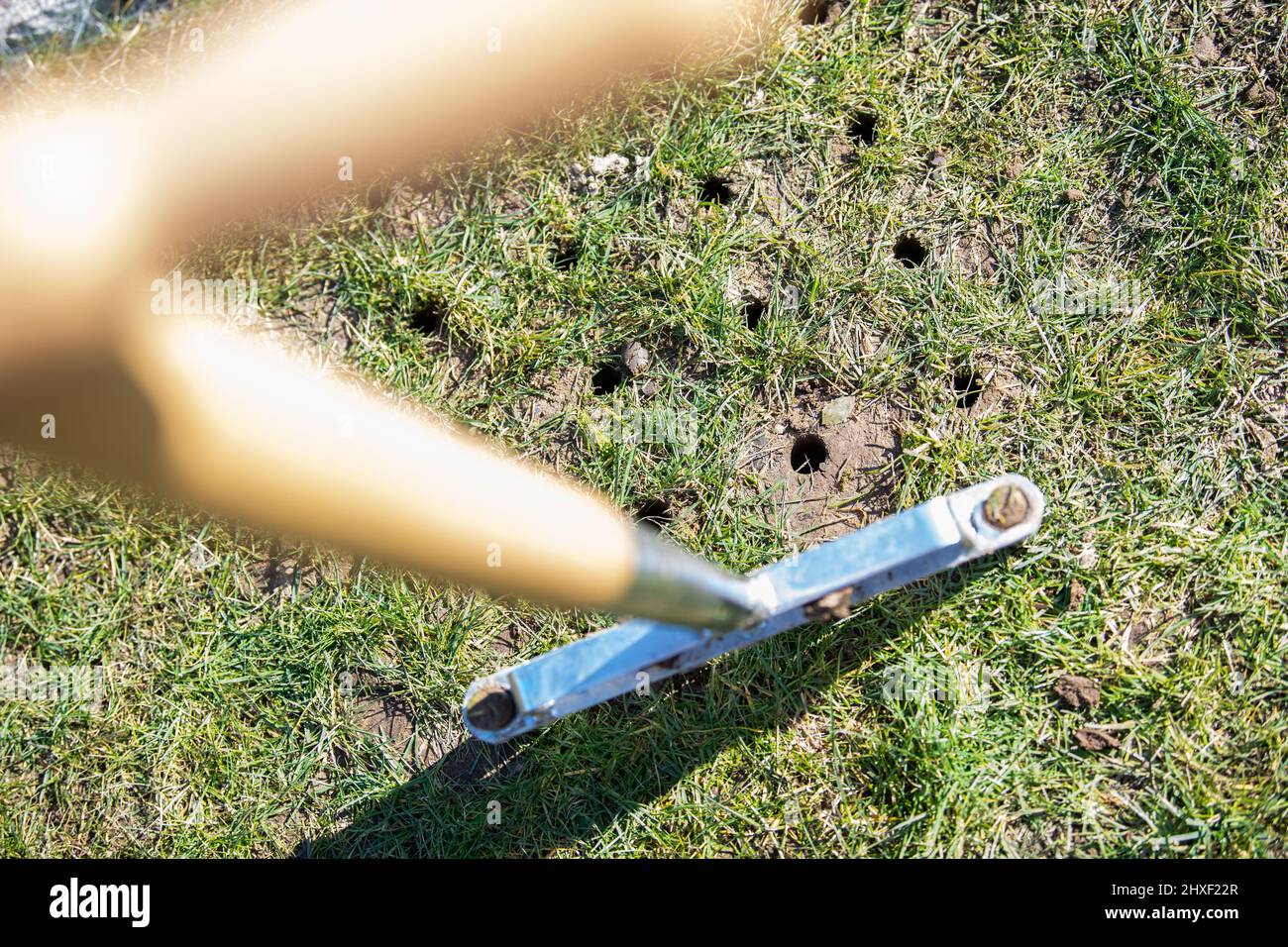 Bad Oeynhausen, Germany. 12th Mar, 2022. An aerator for the lawn is