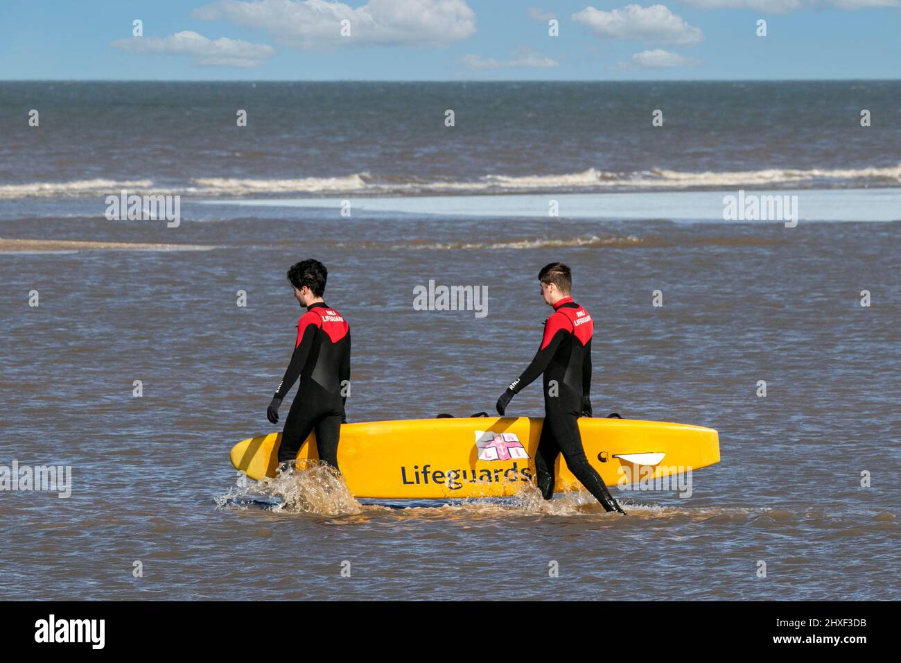 Southport, Merseyside, 12th March 2022.  Preparations are under way for the upcoming summer season as RNLI Lifeguards undergo a training session in the freezing cold Irish Sea along the North West Coastline at Southport.  Credit: Cernan Elias/Alamy Live News Stock Photo