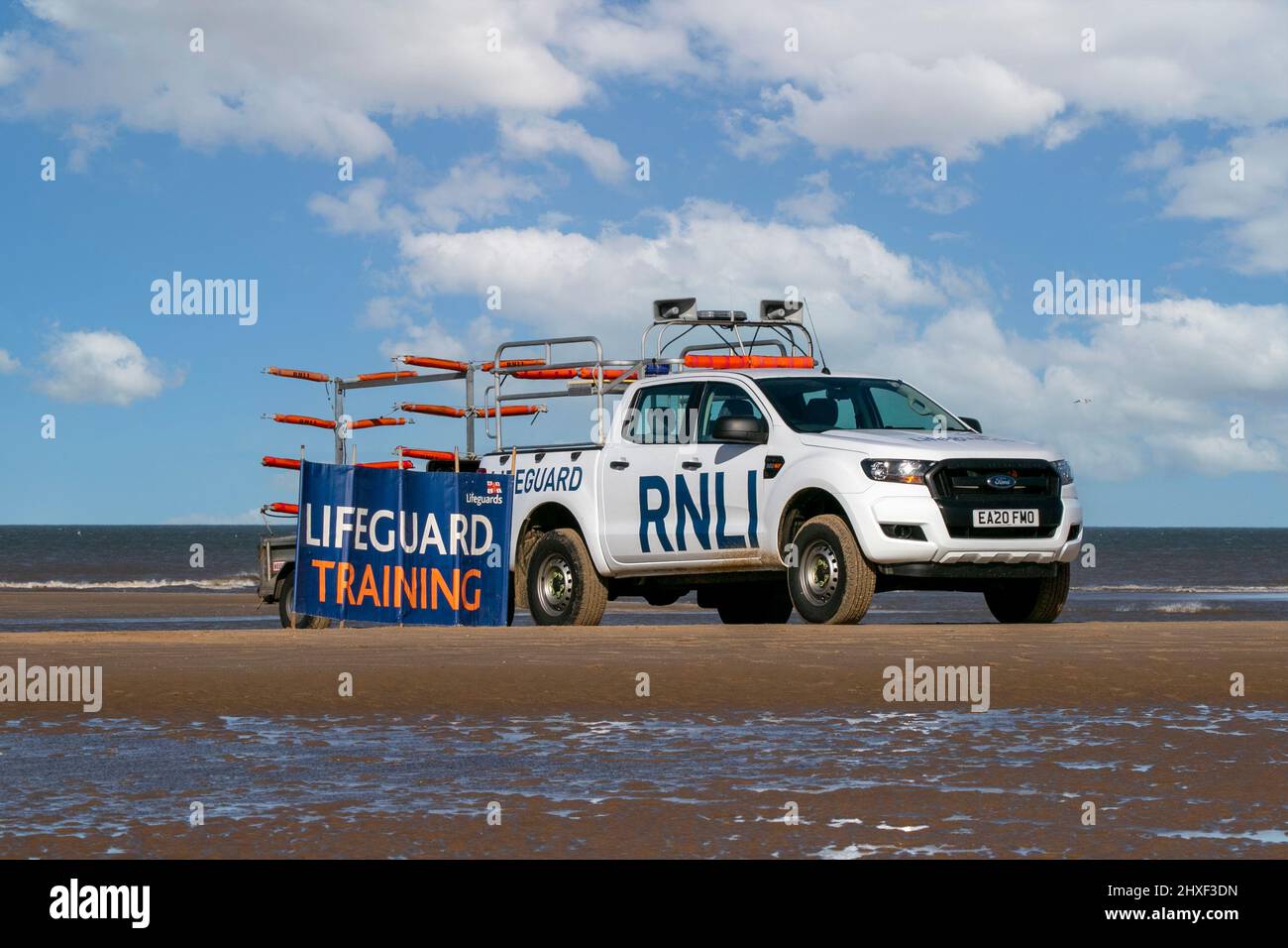 Southport, Merseyside, 12th March 2022.  Preparations are under way for the upcoming summer season as RNLI Lifeguards undergo a training session in the freezing cold Irish Sea along the North West Coastline at Southport.  Credit: Cernan Elias/Alamy Live News Stock Photo