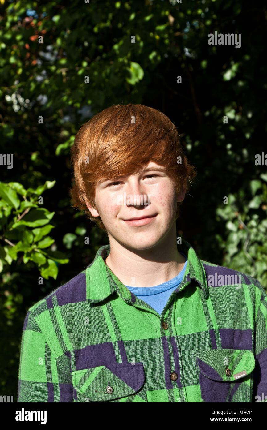portrait of attractive happy smiling boy in the garden Stock Photo - Alamy