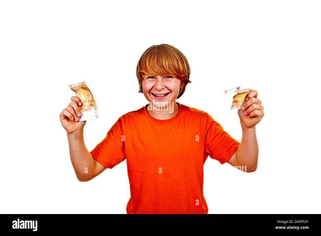 Euros flying around a boys head Stock Photo