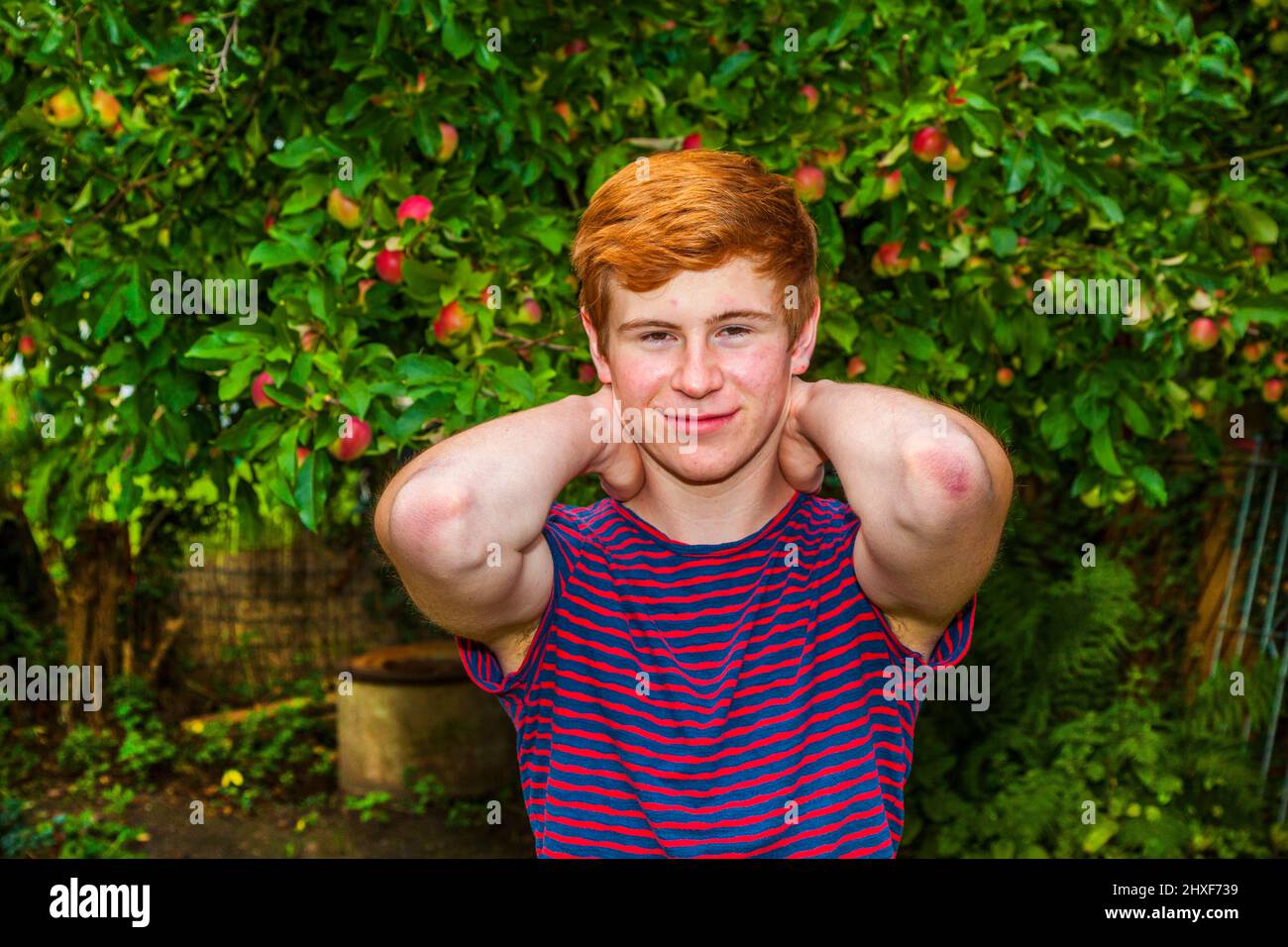 portrait of attractive happy smiling boy in the garden Stock Photo - Alamy