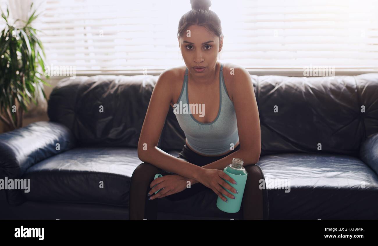 My legs feel like jelly. Shot of a young woman cooling down completing