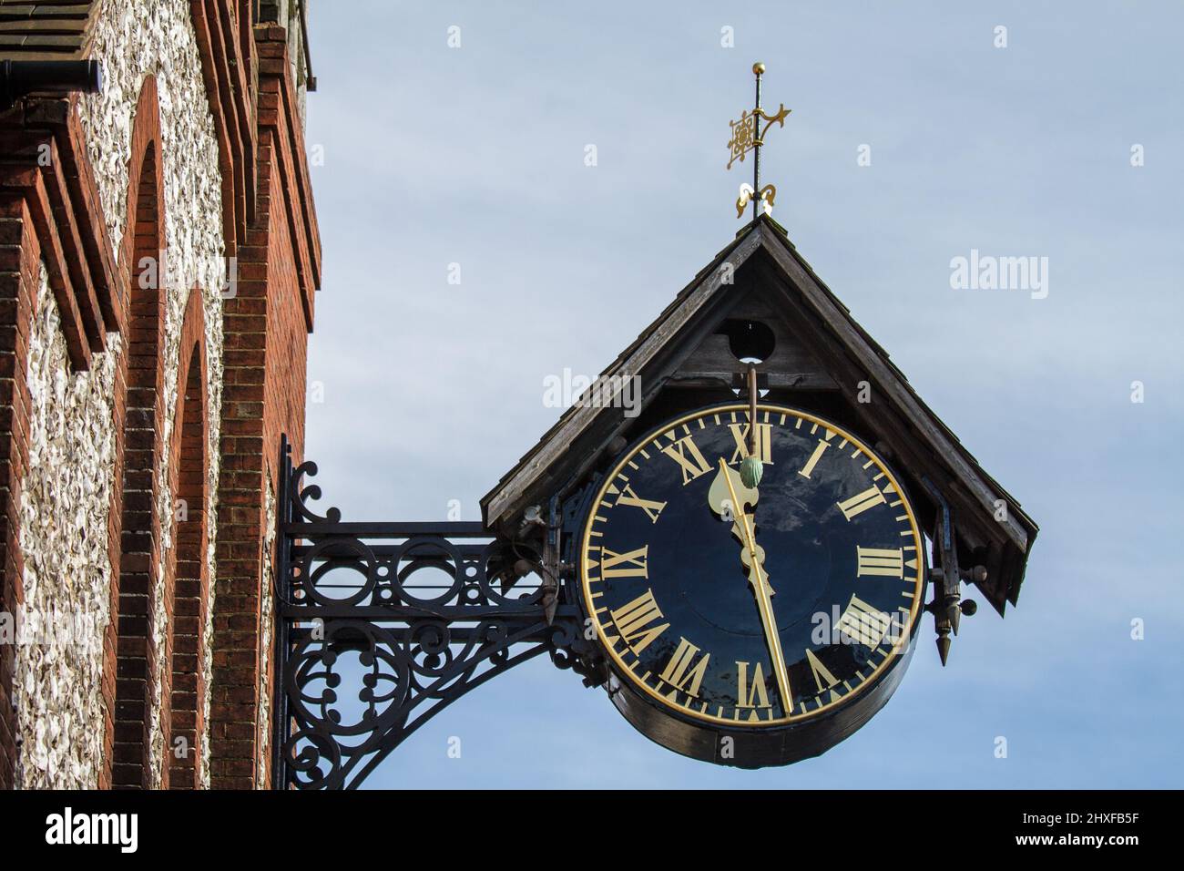 St Michael's Church Hall Clock - High Street, Lewes, UK.  This clock is attached to the south east face of St Michael's Church Hall on the north west Stock Photo