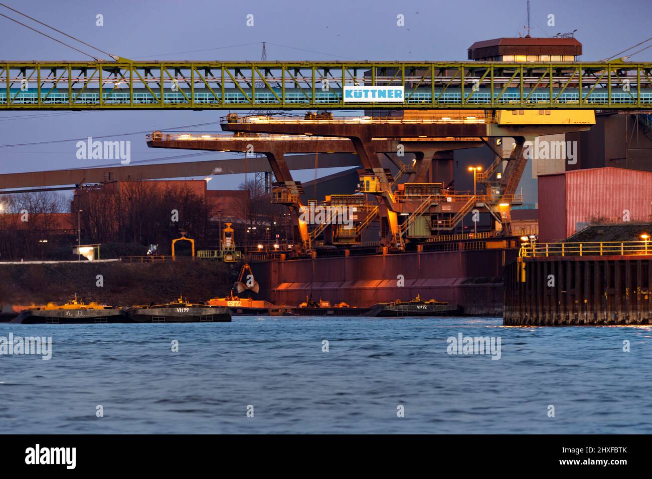 Harbor cranes unloading, southern port Walsum of Thyssenkrupp Steel Europe AG on the Rhine Stock Photo
