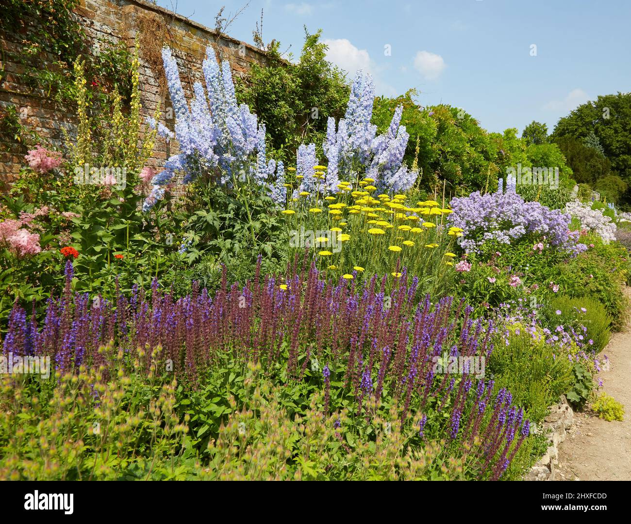 Magnificent walled herbaceous border at Waterperry Gardens near Oxford UK Stock Photo