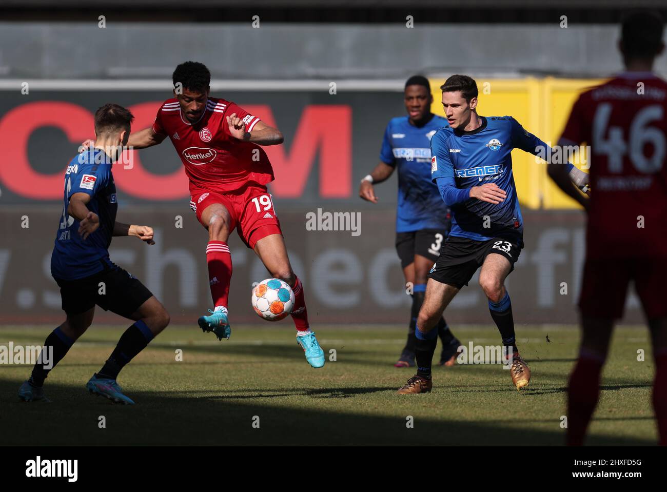 Paderborn, Germany. 12th Mar, 2022. Soccer: 2nd Bundesliga, SC Paderborn 07 - Fortuna Düsseldorf, Matchday 26 at Benteler Arena. Paderborn's Maximilian Thalhammer (r) battles for the ball with Düsseldorf's Emmanuel Iyoha (2nd from left). Credit: Friso Gentsch/dpa - IMPORTANT NOTE: In accordance with the requirements of the DFL Deutsche Fußball Liga and the DFB Deutscher Fußball-Bund, it is prohibited to use or have used photographs taken in the stadium and/or of the match in the form of sequence pictures and/or video-like photo series./dpa/Alamy Live News Stock Photo