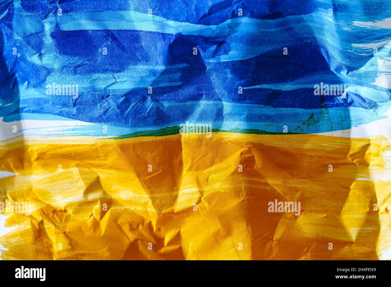 Ukraine colors at the folded white paper Stock Photo