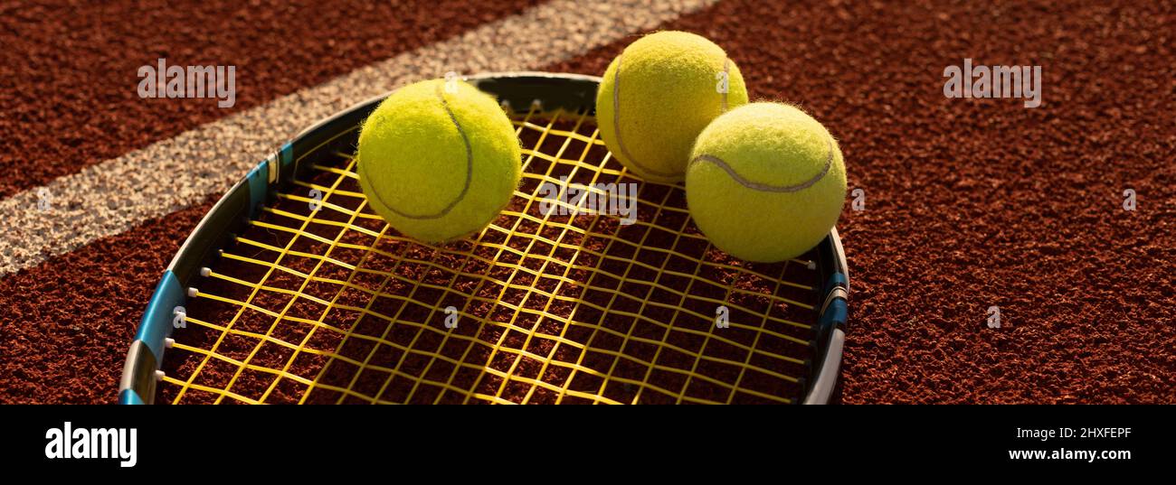 Tennis Ball with Racket on the racket in tennis court Stock Photo Alamy