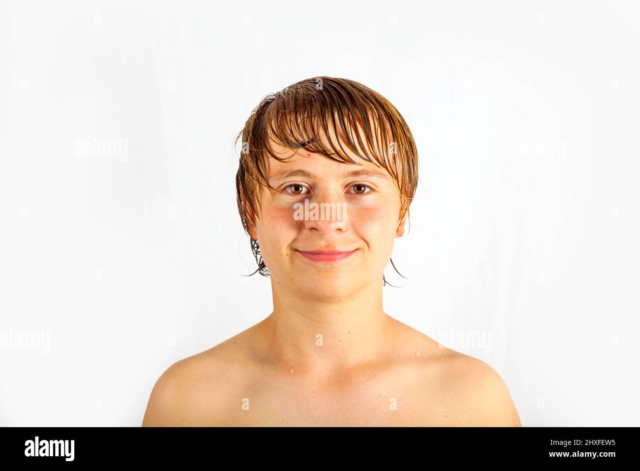 smart handsome boy with wet hair poses in Studio Stock Photo Alamy
