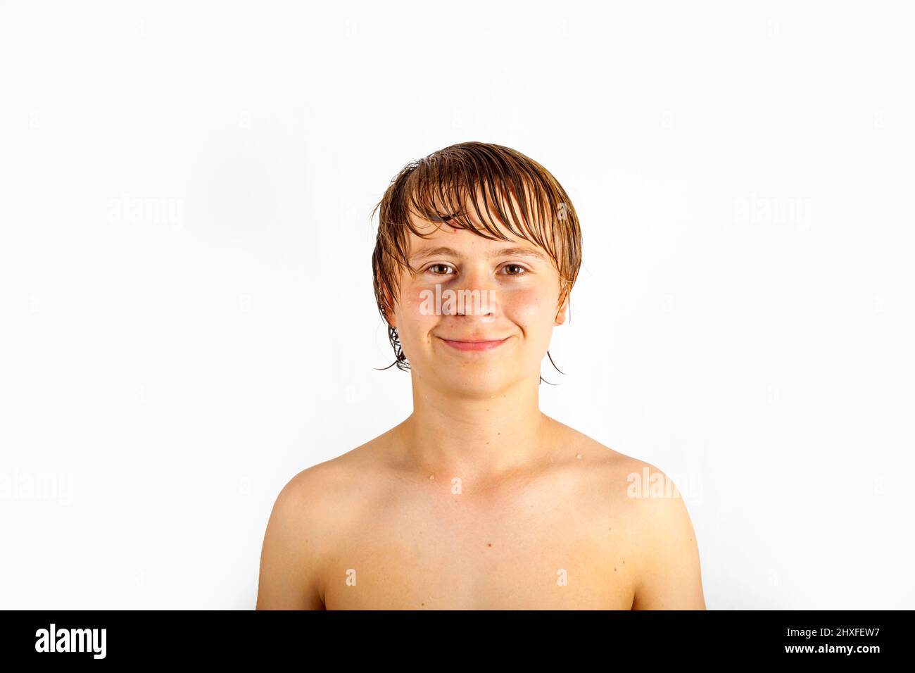 smart handsome boy with wet hair poses in Studio Stock Photo Alamy