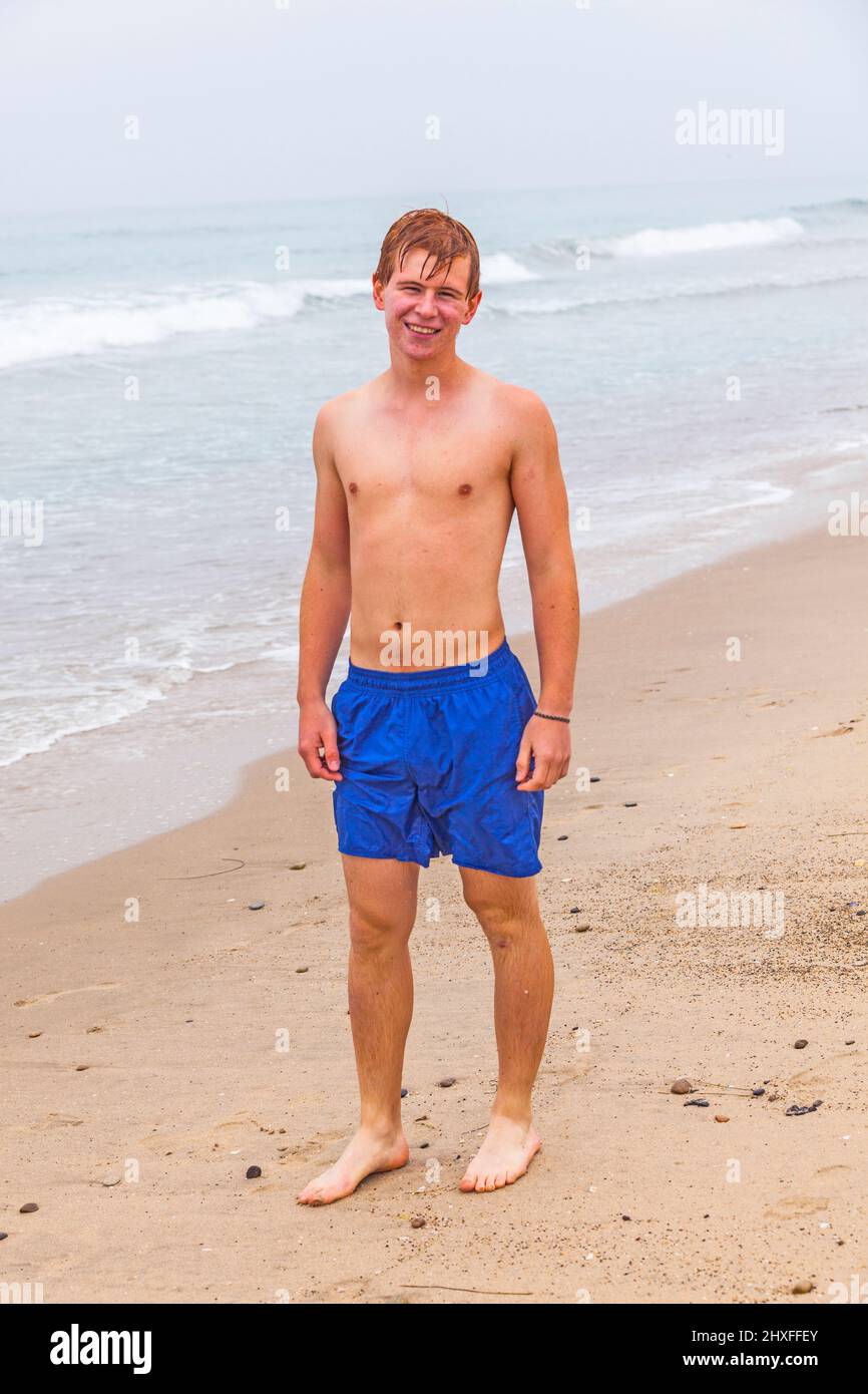 attractive-young-boy-at-the-beach-stock-photo-alamy