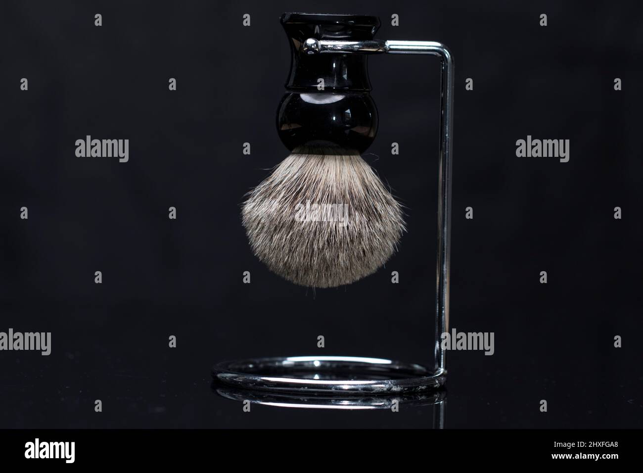 Shaving brush close up badger bristle brush for shaving. Close up brush for shaving cream. Stock Photo