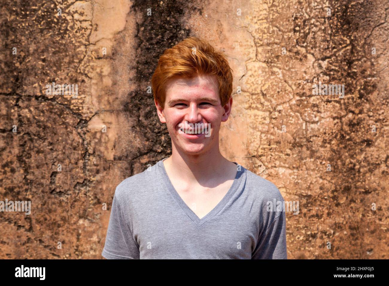 portrait of 16 years old boy in historic amber fort in India Stock