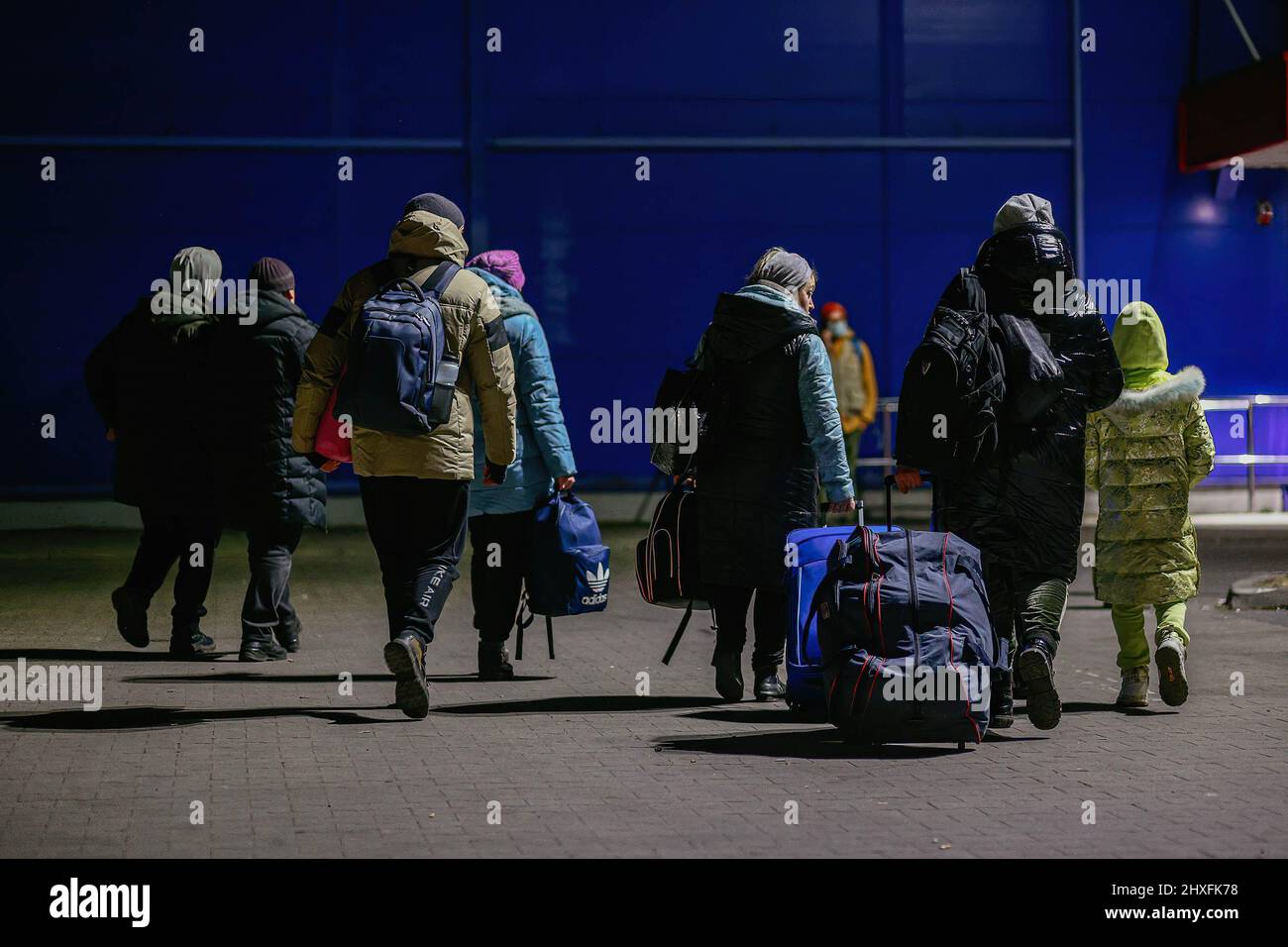 Refugees seen carrying their luggage. A former shopping mall in Przemysl - transformed by volunteers into one of the largest refugee aid centers in the region. Since the beginning of the Russian invasion of Ukraine, over 1.4 million people have fled to Poland to escape the war. Ukrainian refugees are being welcomed with complex support from both charity organizations and ordinary Poles, but many humanitarian experts indicate that with such a huge influx of people and not enough support from Polish government, a crisis could occur within few weeks. (Photo by Filip Radwanski / SOPA Images/Sipa U Stock Photo