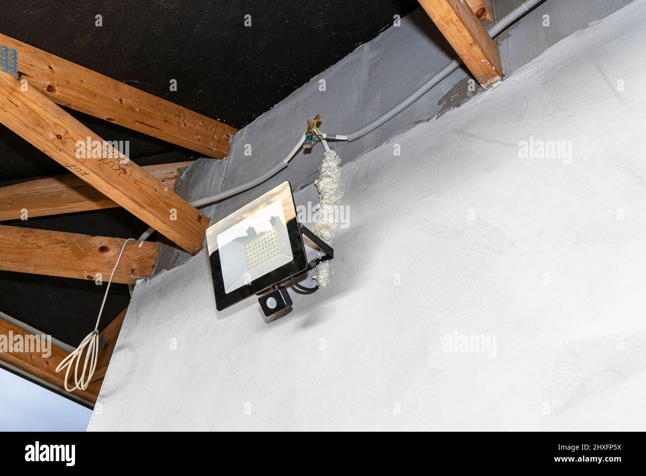 The light for the motion sensor mounted on the facade of the building