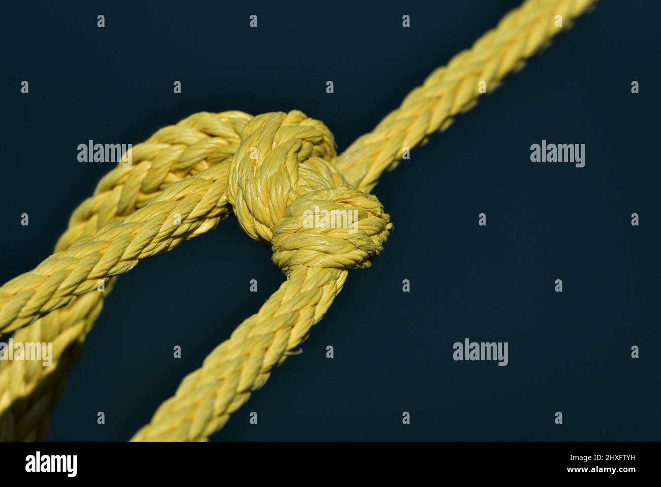 Close up of a wooden yo-yo with yellow string on white background Stock  Photo - Alamy