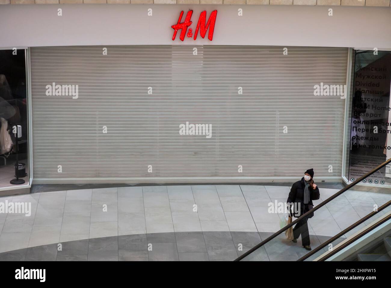 Moscow, Russia. 12th of March, 2022 Customer stay near a closed H&M store  at the Metropolis
