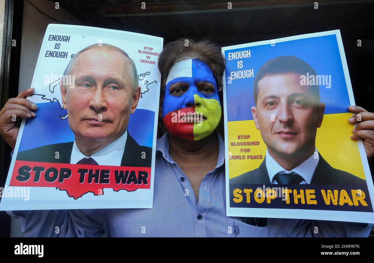 Bhopal, India. 12th Mar, 2022. A peace campaigner with his face painted with the colors of the national flags of Russia and Ukraine, holds portraits of Russian President, Vladimir Putin and Ukrainian President, Volodymyr Zelensky making an appeal to stop war. Russia began an invasion of Ukraine on Feb, 22, 2022 which is said to be the largest conventional military attack in Europe since World War II. Credit: SOPA Images Limited/Alamy Live News Stock Photo