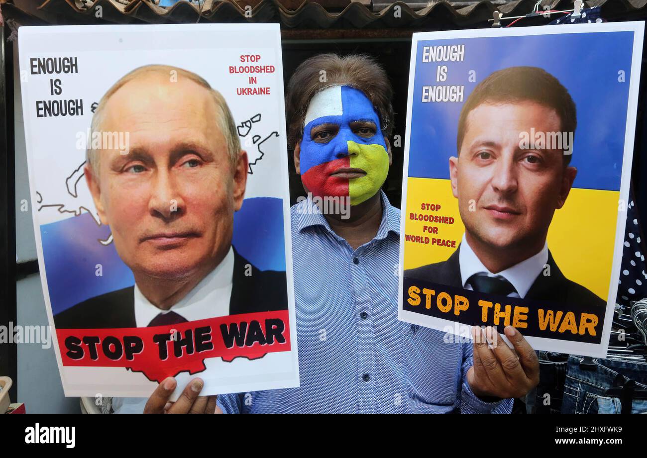 Bhopal, India. 12th Mar, 2022. A peace campaigner with his face painted with the colors of the national flags of Russia and Ukraine, holds portraits of Russian President, Vladimir Putin and Ukrainian President, Volodymyr Zelensky making an appeal to stop war. Russia began an invasion of Ukraine on Feb, 22, 2022 which is said to be the largest conventional military attack in Europe since World War II. (Photo by Sanjeev Gupta/SOPA Images/Sipa USA) Credit: Sipa USA/Alamy Live News Stock Photo