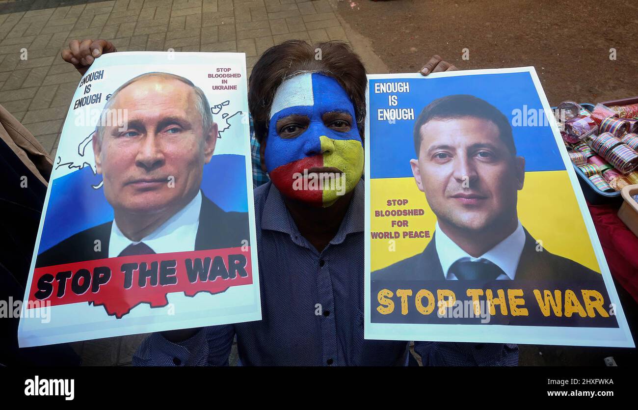 Bhopal, India. 12th Mar, 2022. A peace campaigner with his face painted with the colors of the national flags of Russia and Ukraine, holds portraits of Russian President, Vladimir Putin and Ukrainian President, Volodymyr Zelensky making an appeal to stop war. Russia began an invasion of Ukraine on Feb, 22, 2022 which is said to be the largest conventional military attack in Europe since World War II. (Photo by Sanjeev Gupta/SOPA Images/Sipa USA) Credit: Sipa USA/Alamy Live News Stock Photo