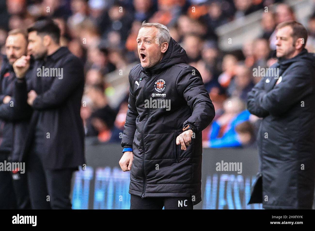 Neil Critchley head coach of Blackpool gives his team instructions