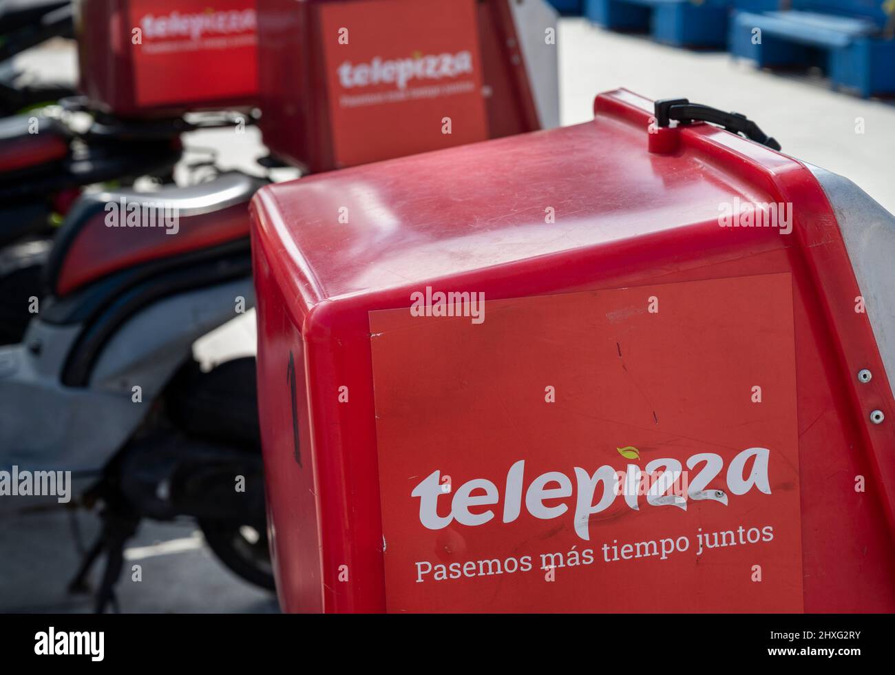 Spanish fast-food restaurant chain of Telepizza delivery motorcycles seen parked on the street in Spain. Stock Photo