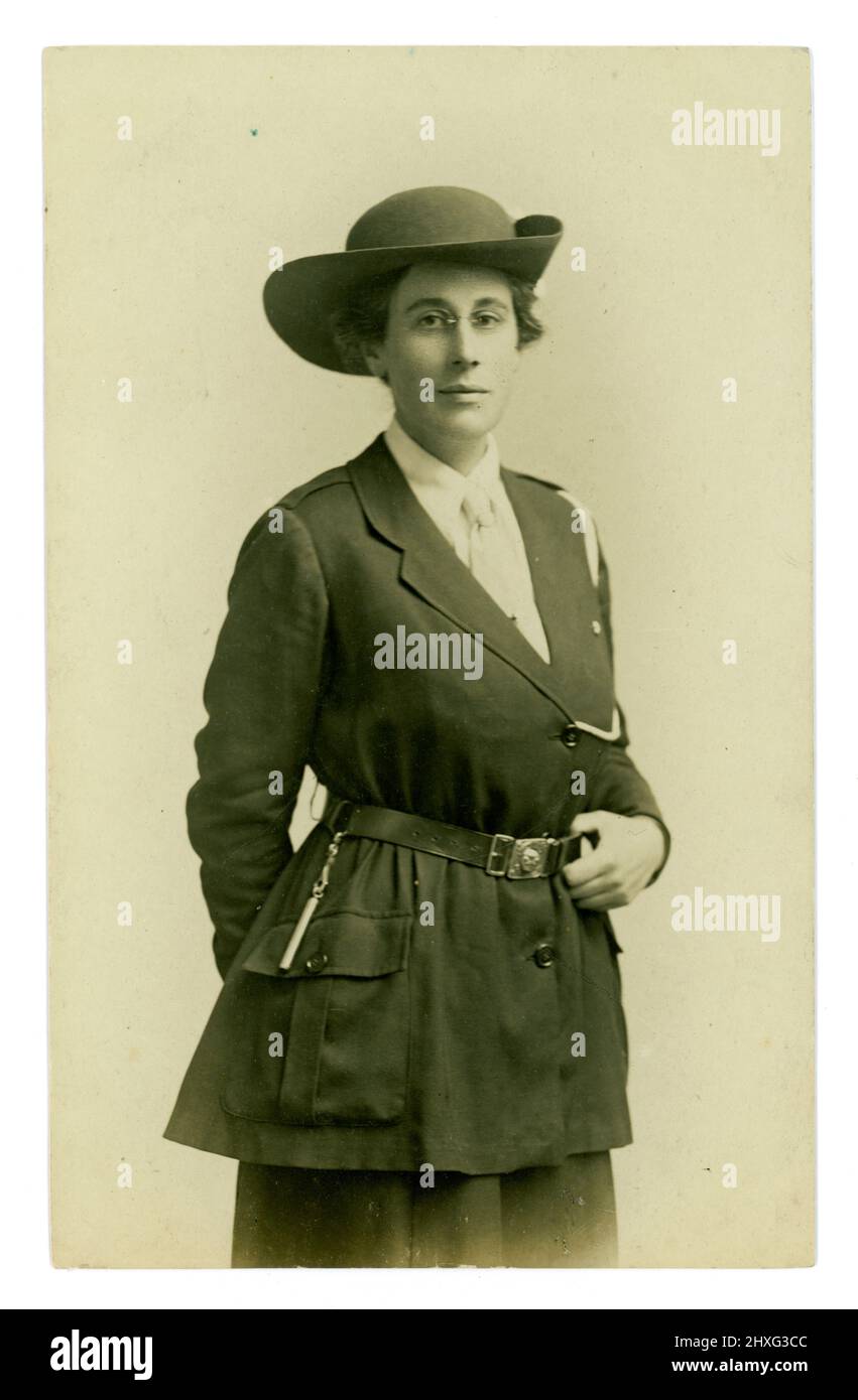 Original WW1 era portrait of girl guide leader or possibly a home front volunteer in uniform with whistle, shoulder cord - possibly she was a member of the women's voluntary patrols. (These Women’s Patrols were suggested by The Headmistresses' Association and the Federation of University Women. The War Office gave permission for these patrols to take place outside military camps to stop local woman from becoming too friendly with the soldiers and also to keep a check on morality in cinemas). Studio of Mora Ltd. Western Road and London Rd, Brighton, U.K. more research needed. Stock Photo