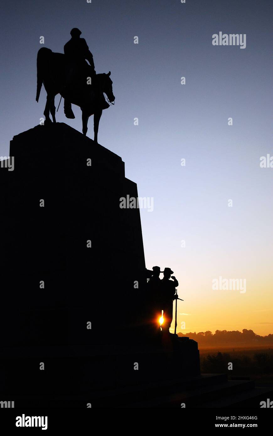 The sun peaks through the Virginia Regiment Memorial on the grounds of Gettysburg National Battlefield Stock Photo