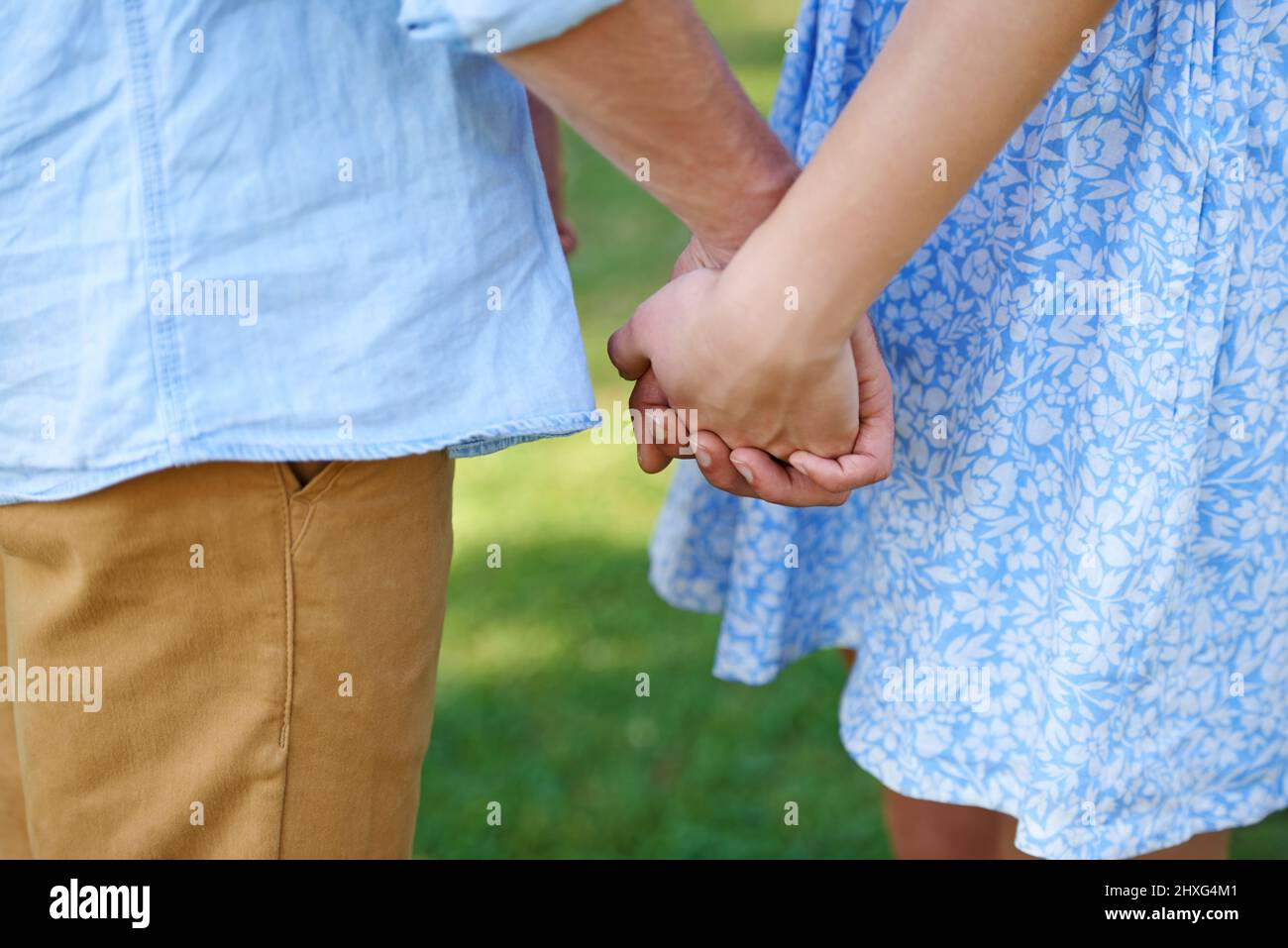 Young man woman holding hands hi-res stock photography and images - Alamy