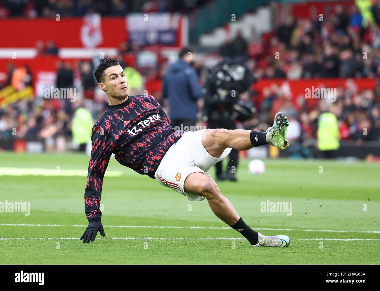 Manchester, England, 12th March 2022. Cristiano Ronaldo of Manchester  United slips during warm up during the