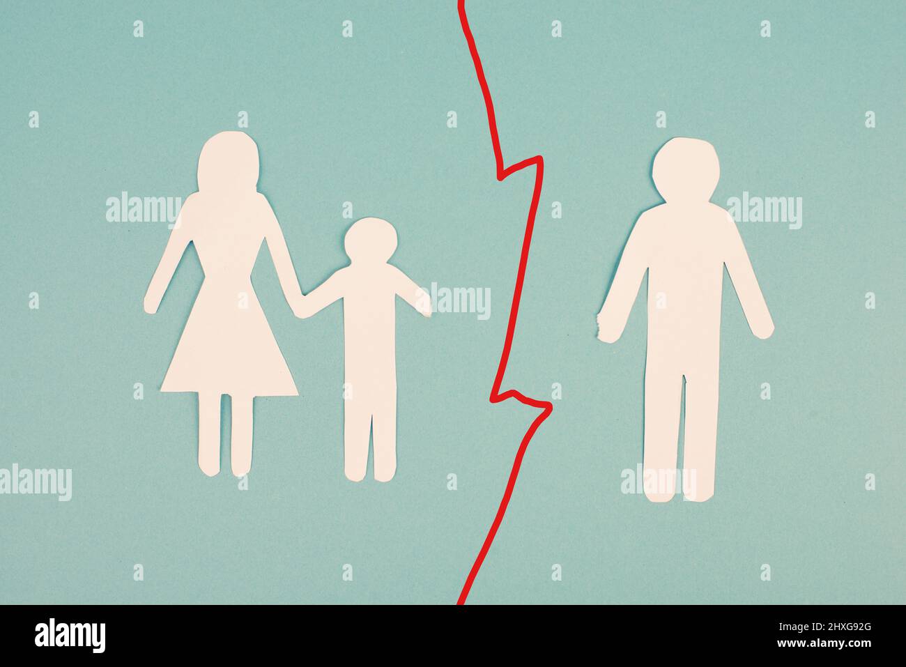 Divorced parents, child with mother, father alone, single mum, custody fight, paper cut out, blue background Stock Photo
