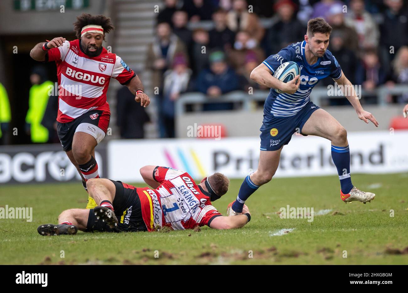 12th March 2022 ; AJ Bell Stadium, Sale, England; Gallagher Premiership rugby, Sale versus Gloucester:  Luke James of Sale Sharks slips the tackle of Harry Elrington of Gloucester Stock Photo