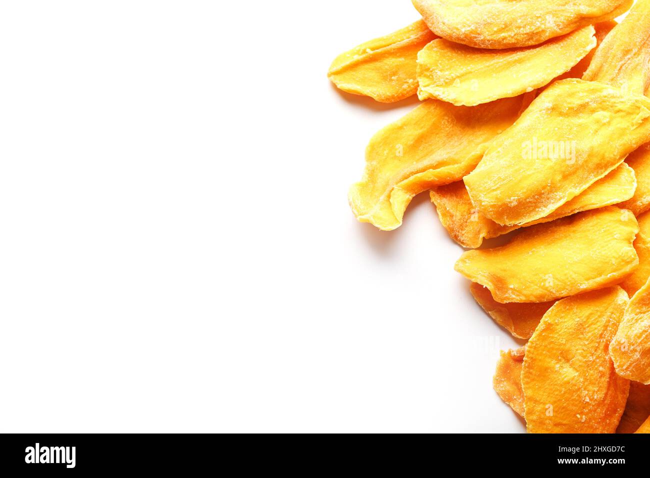 Organic dried mango fruit slices isolated on white background Stock Photo