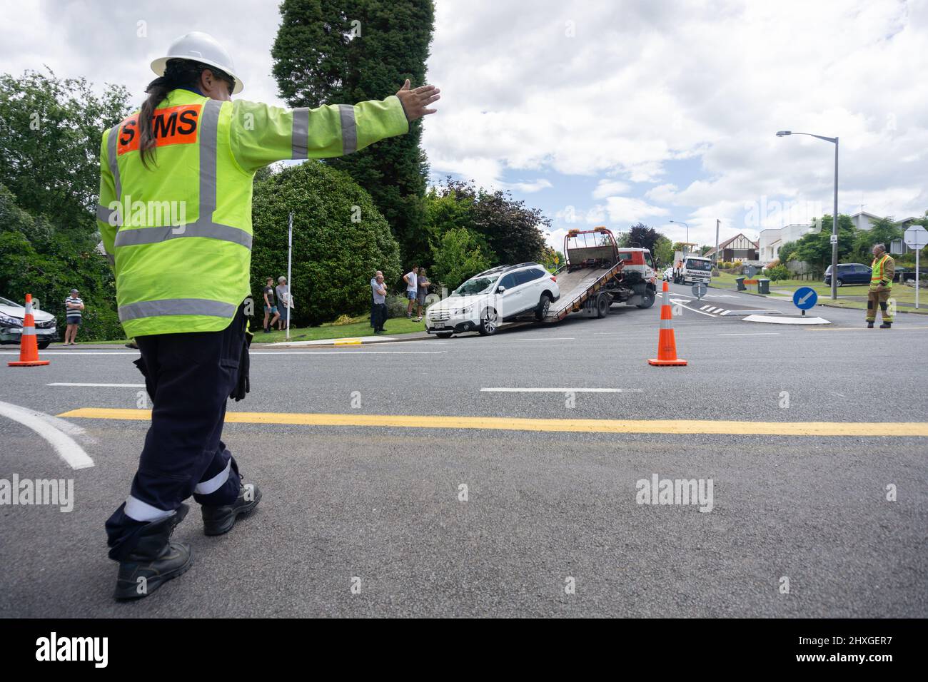 Tauranga New Zealand December 16 2015; Man with arm out directs