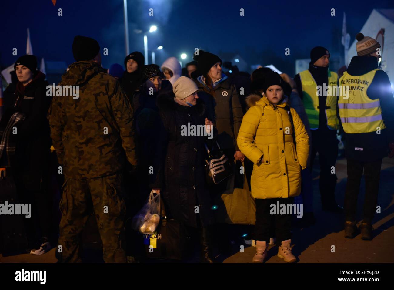 Milan, Lombardy, Italy. 12th Mar, 2022. Ukrainian refugees await the bus that will take them to shelter centers scattered throughout the country. Medyka PrzemyÅ›l, Poland, (Credit Image: © Ervin Shulku/ZUMA Press Wire) Stock Photo