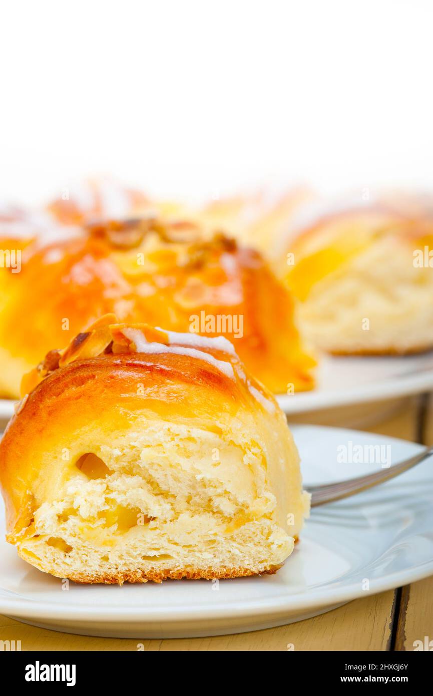 fresh home baked sweet bread donut cake with almonds and icing sugar on