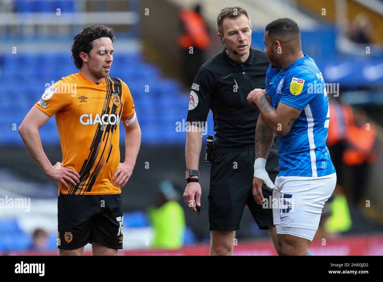 George Honeyman #10 of Hull City and Onel Hernandez #25 of Birmingham City speak with Referee Michael Salisbury Stock Photo