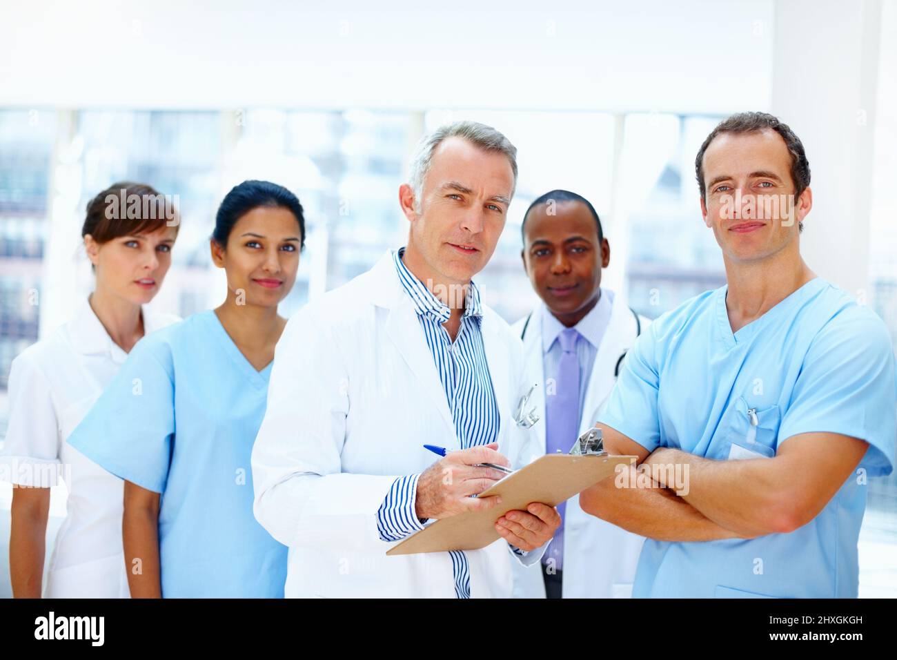 Group of healthcare professionals. Diverse team of healthcare professionals looking serious. Stock Photo