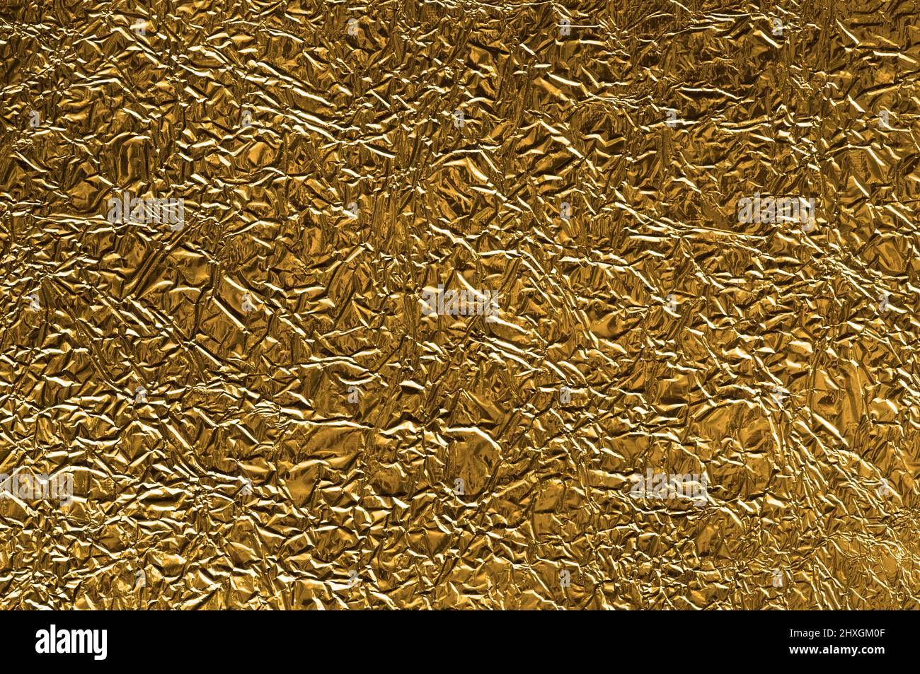 https://c8.alamy.com/comp/2HXGM0F/crumpled-golden-metal-foil-background-2HXGM0F.jpg